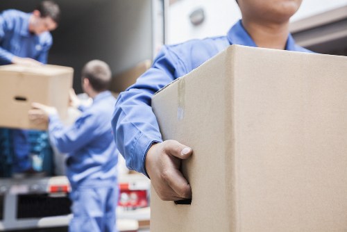 Removal team planning a Hamptonhill move with packed boxes