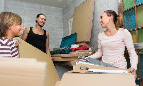 Packed moving boxes and furniture ready for Hamptonhill removals